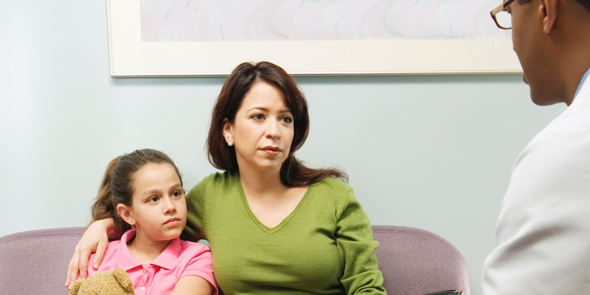 doctor-talking-to-hispanic-mother-and-daughter