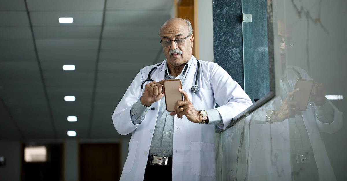 doctor using mobile phone at hospital