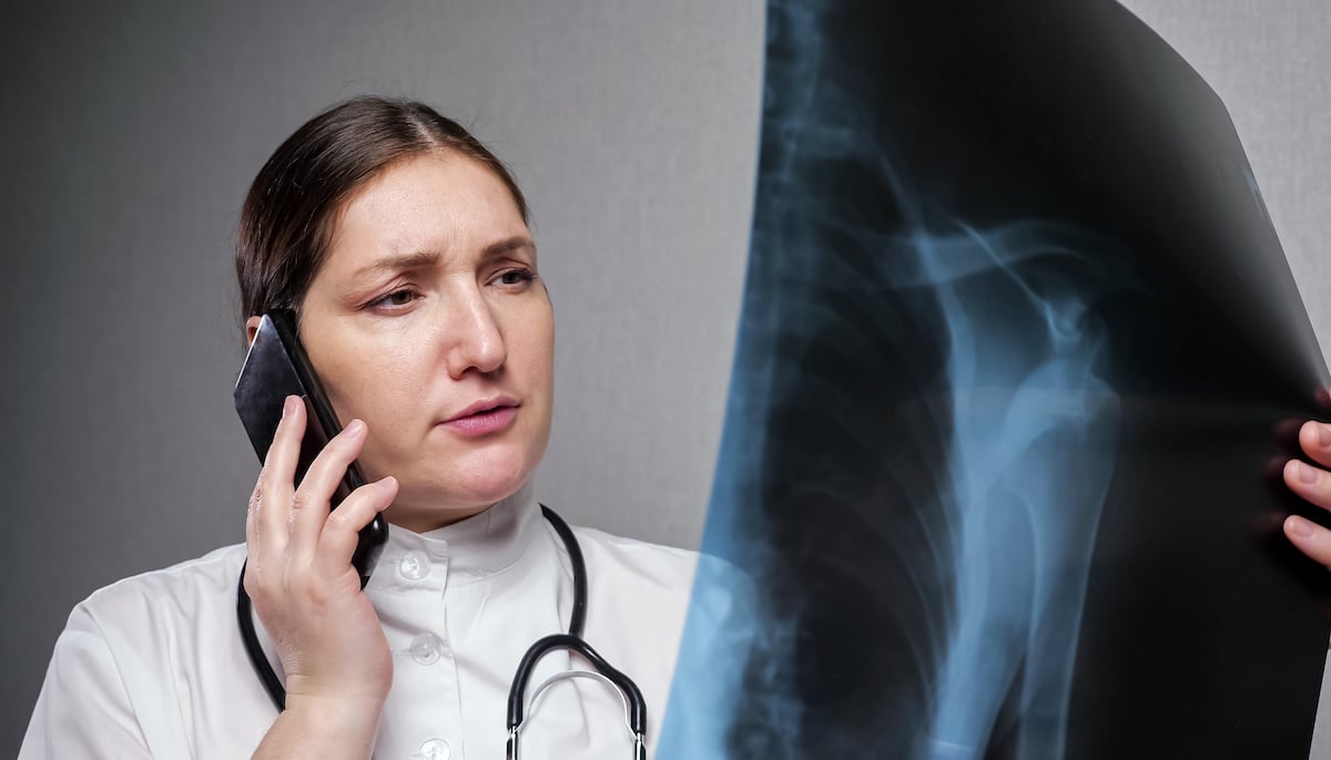 radiologist communicating results on phone-soc