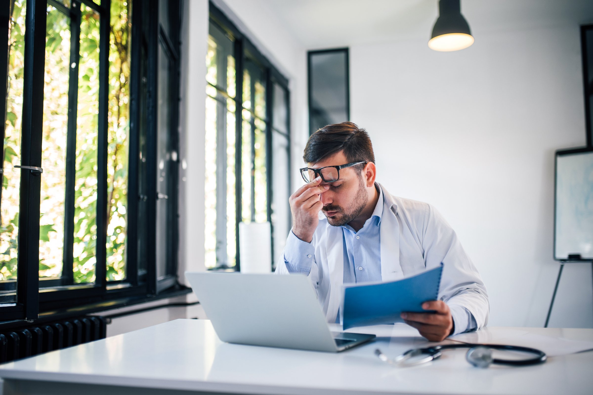 tired-doctor-at-work-in-medical-office-social